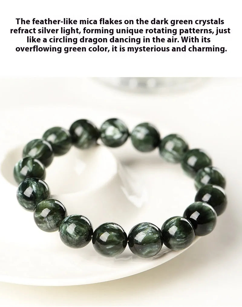 Green Dragon Crystal bracelet with round beads and a central Ruyi knot on a wrist.