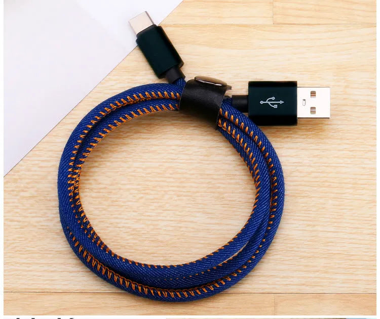 Denim braided USB-C charging cable with aluminium connectors shown in black, blue, and red colour options.