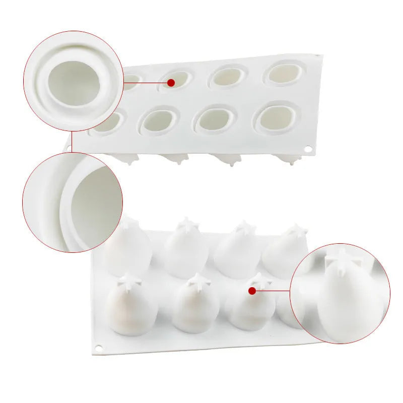Silicone baking mould with six cavities shaped like pineapples, pine cones, and pears on a kitchen worktop.