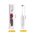 Black and white handheld electric milk frother with modern design for coffee preparation