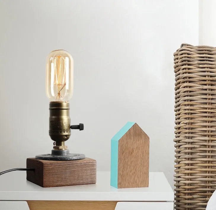 Industrial water pipe table lamp in wood and black iron measuring 9cm wide by 13cm high