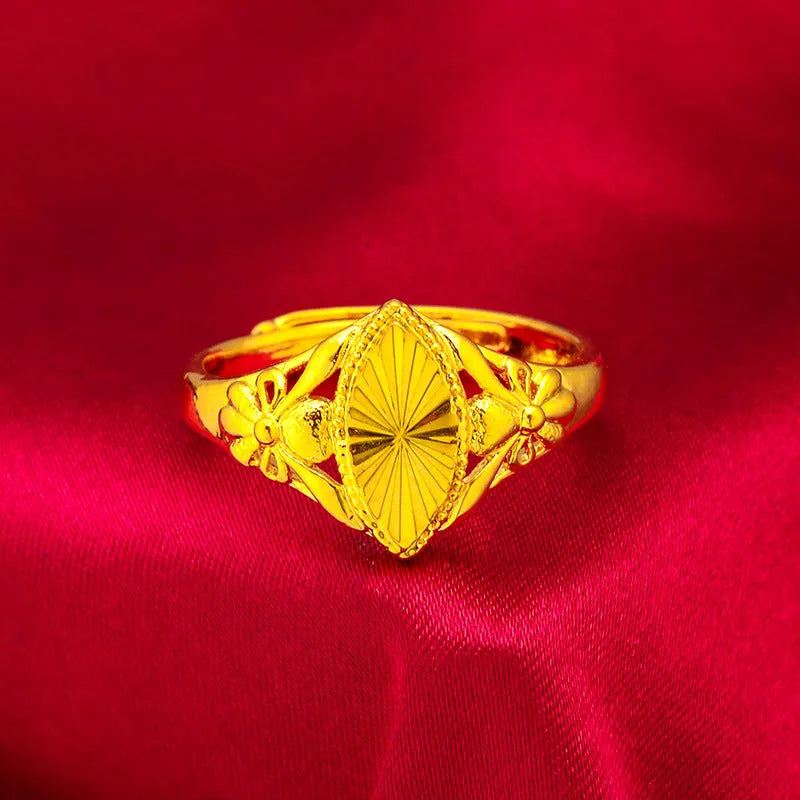 Electroplated gold brass ring with geometric open diamond floral design and textured detailing