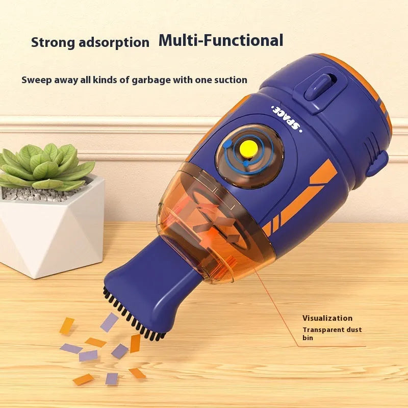 Handheld USB desktop vacuum cleaner in blue colour on a desk next to a keyboard