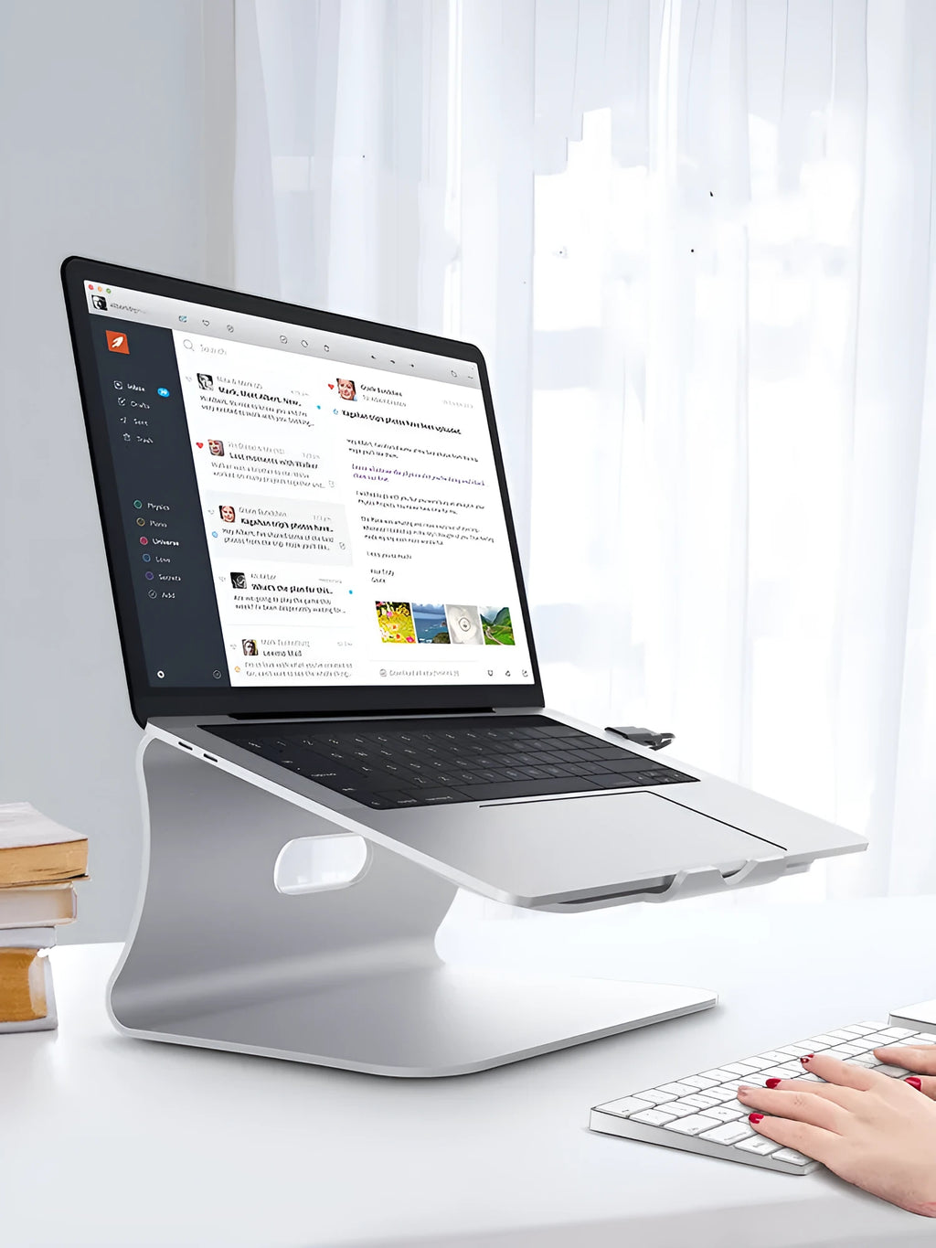 Aluminium laptop cooling bracket in grey or silver with rotary adjustability for mounting fans.