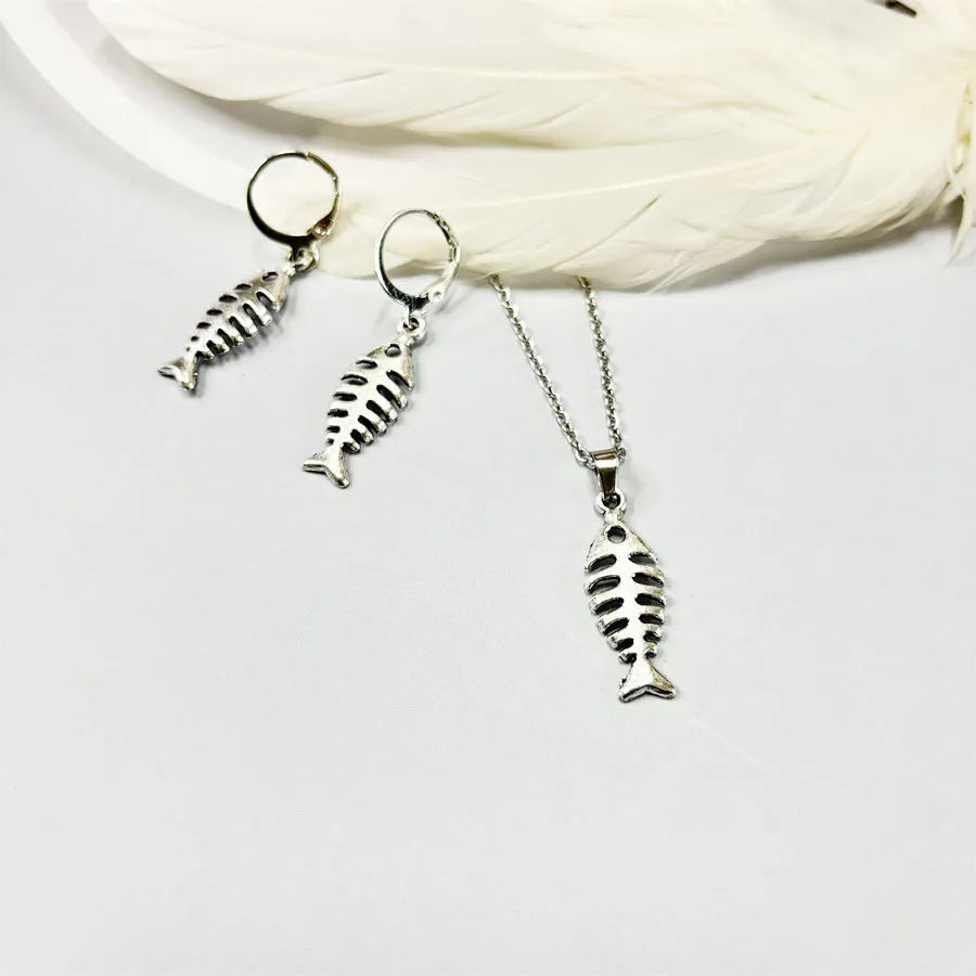 Women's retro-style alloy fishbone pendant necklace and matching earrings set on a white background