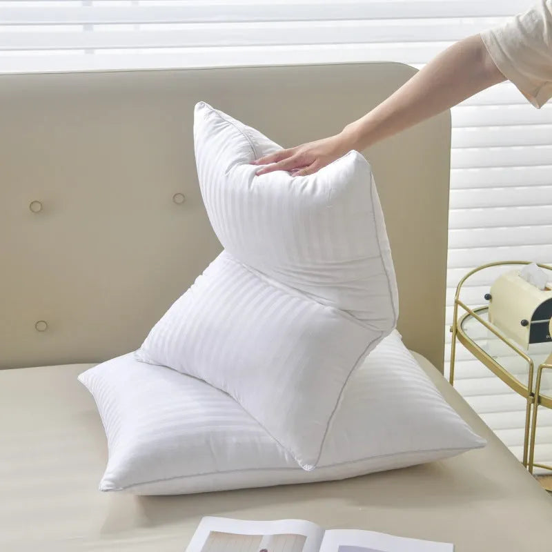 White hotel cotton satin stripe feather pillow showing 2cm stripe detail, shown in three sizes.