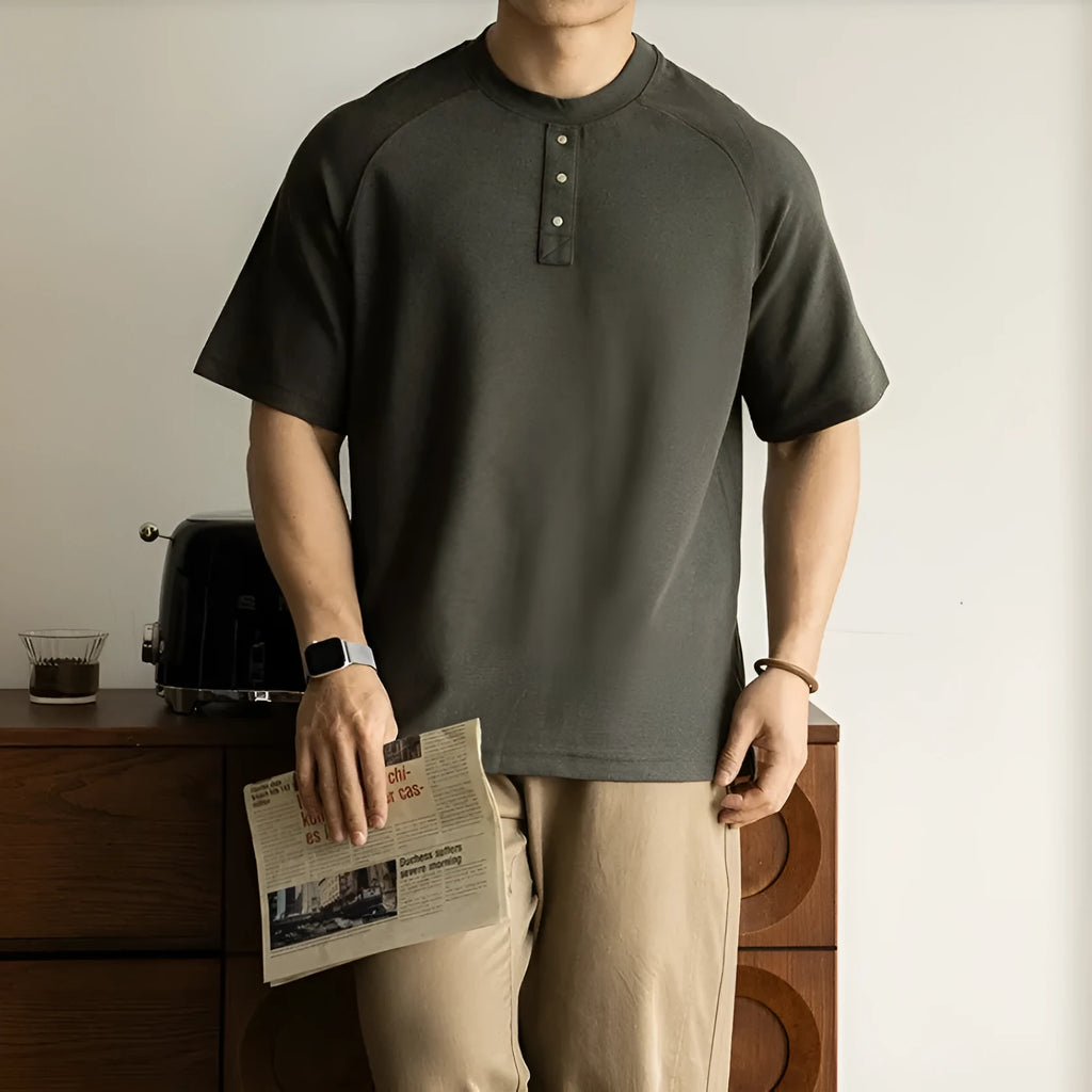 Women's loose grey casual top with raglan sleeves and a terry texture fabric.