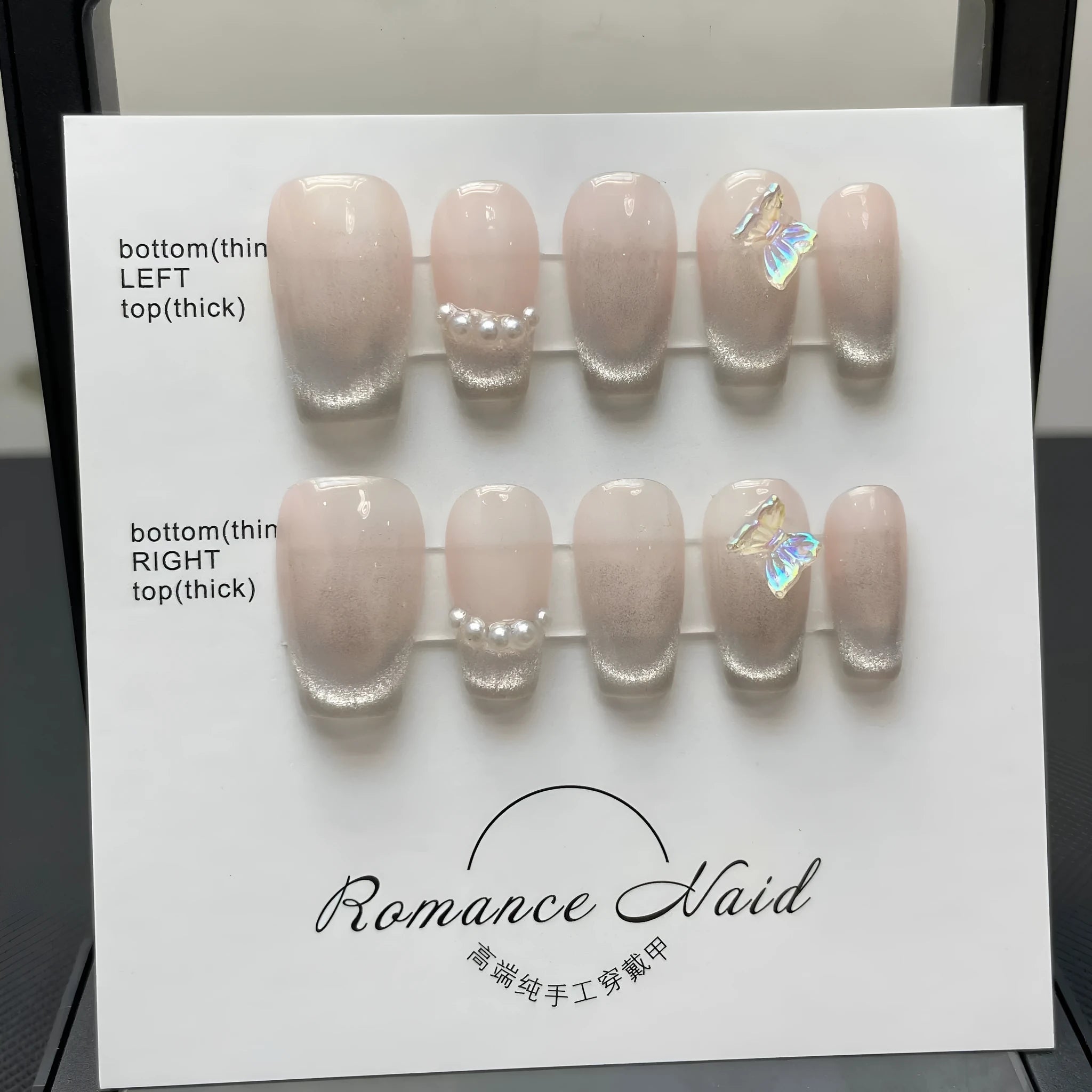 Set of short, blush-coloured handmade false nails displayed in sizes XS, S, M, L
