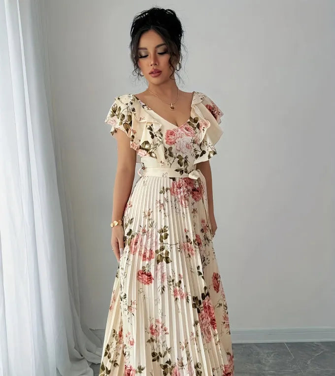 Apricot-coloured women's V-neck dress with a digital floral print, ruffled short sleeves, and a flowing oversized swing skirt.