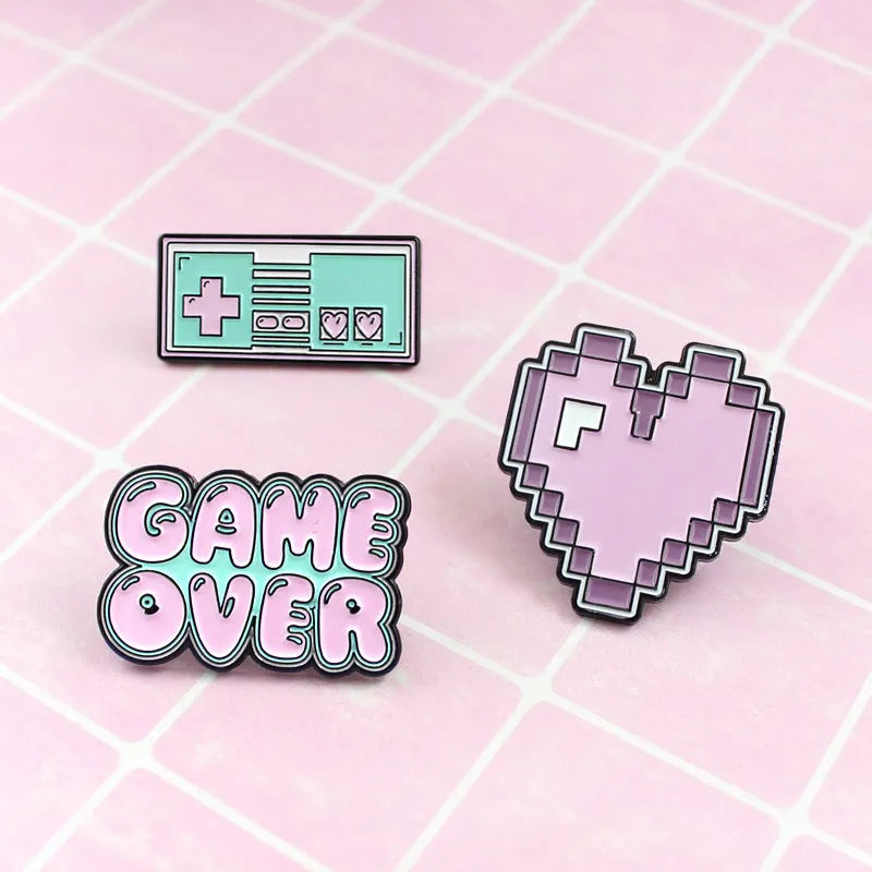 Stereo game console badge made from alloy metal in one of three colour options
