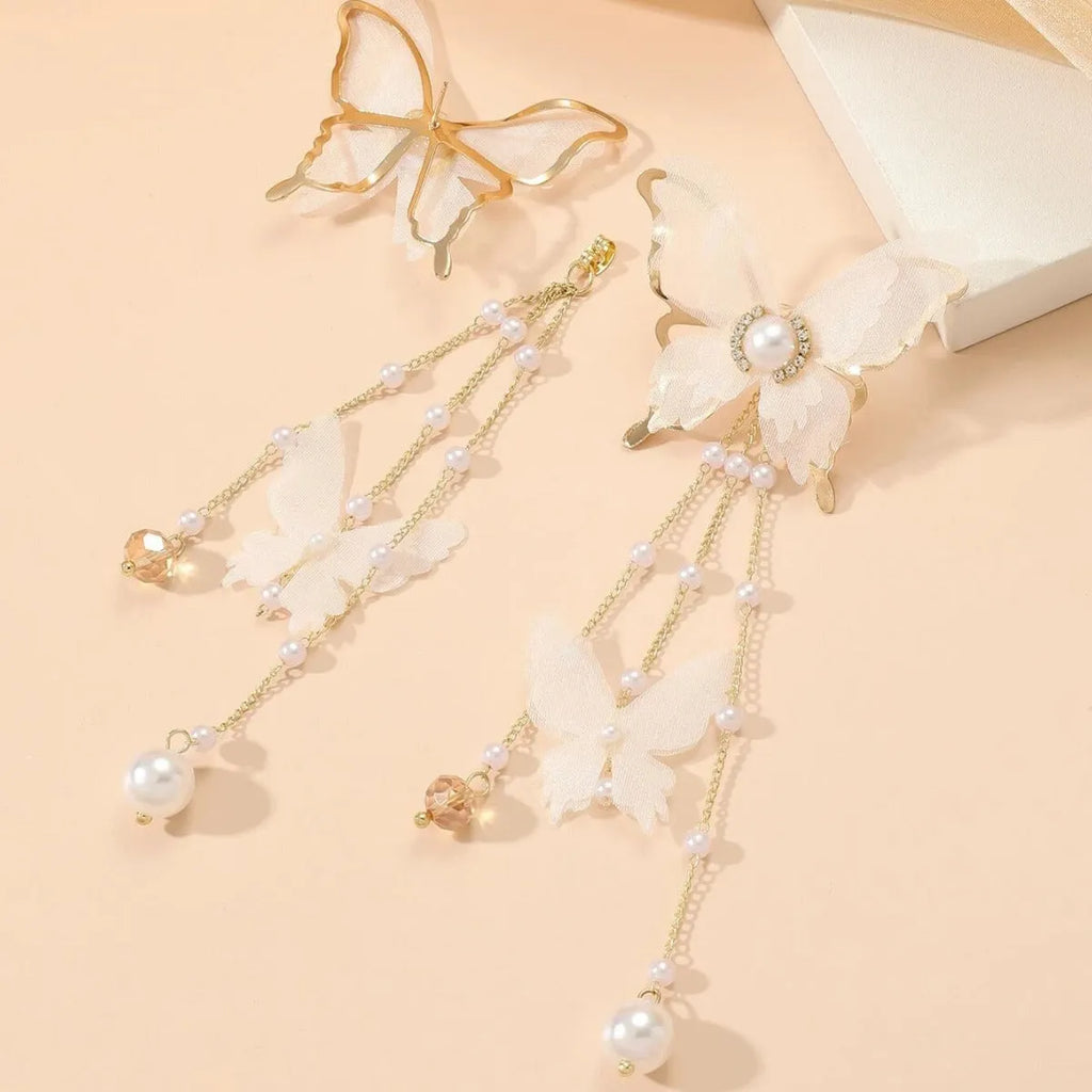 Butterfly shaped white earrings with tassel lace design and pearl rhinestone accents on copper alloy