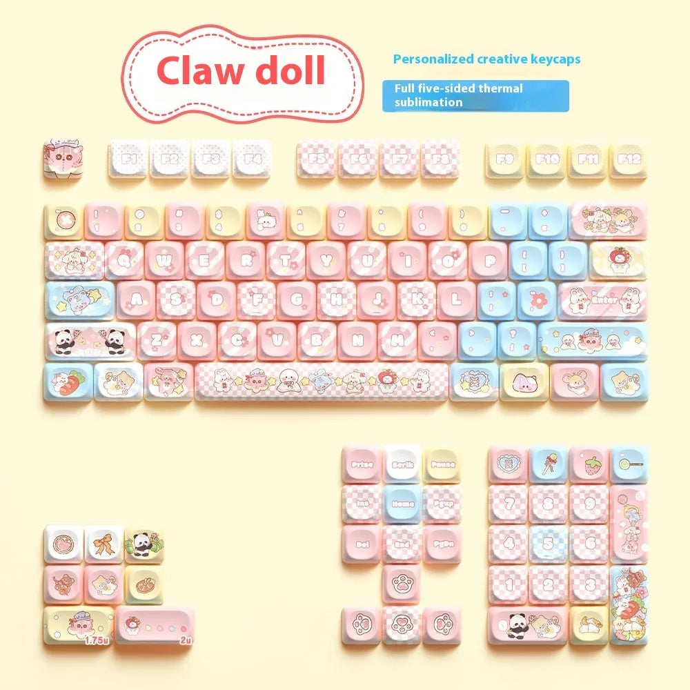 Doll-themed mechanical keyboard keycap set with sublimation printed designs in boxed packaging