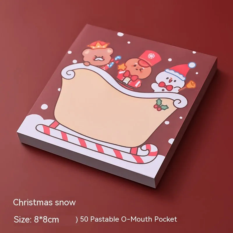 Christmas cartoon sticky notes pad with festive designs including Santa Claus and snowman