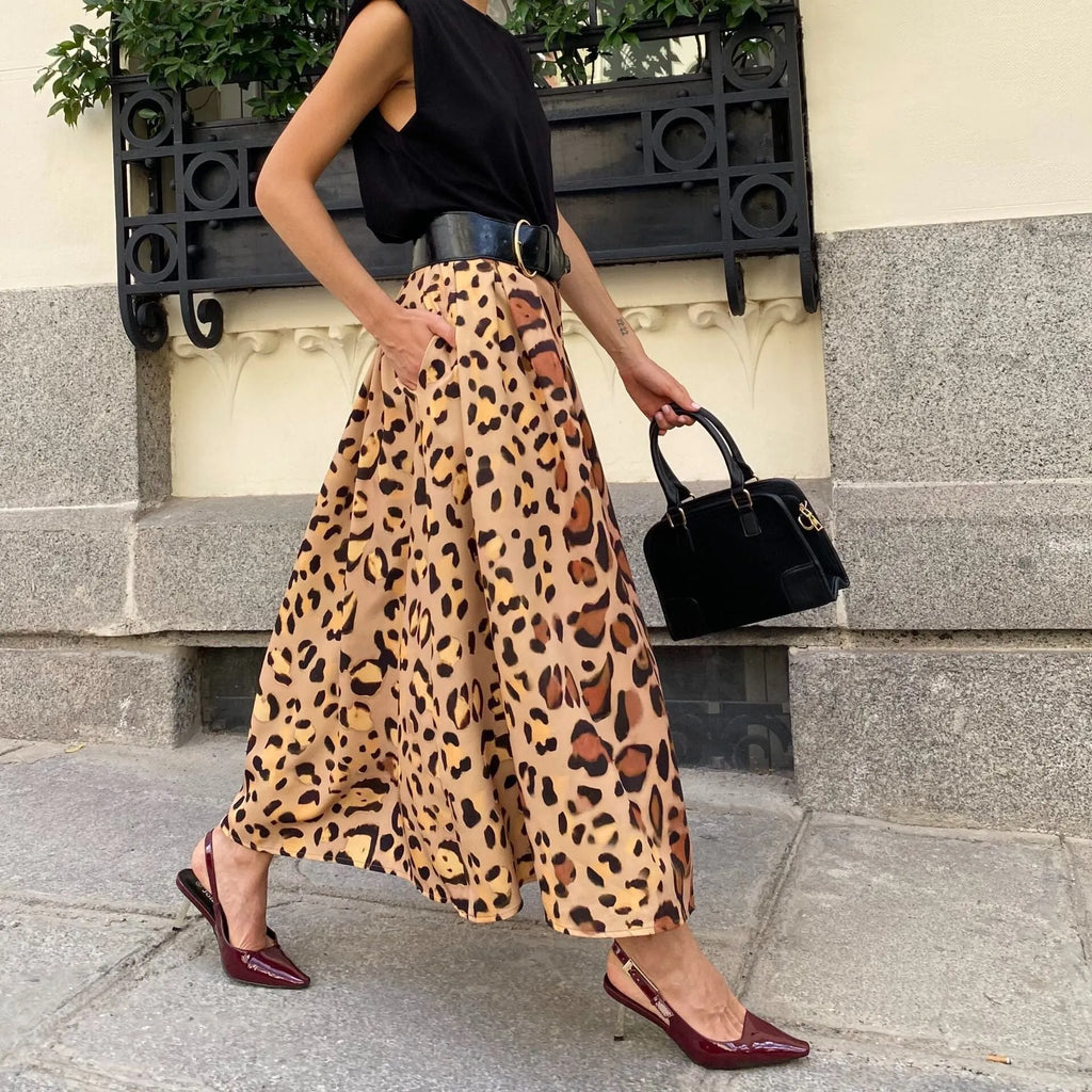 Women's brown leopard print A-line long skirt with big hem detail and animal pattern design