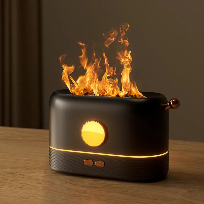 Black USB desktop humidifier with glowing simulated flame effect and water mist output.