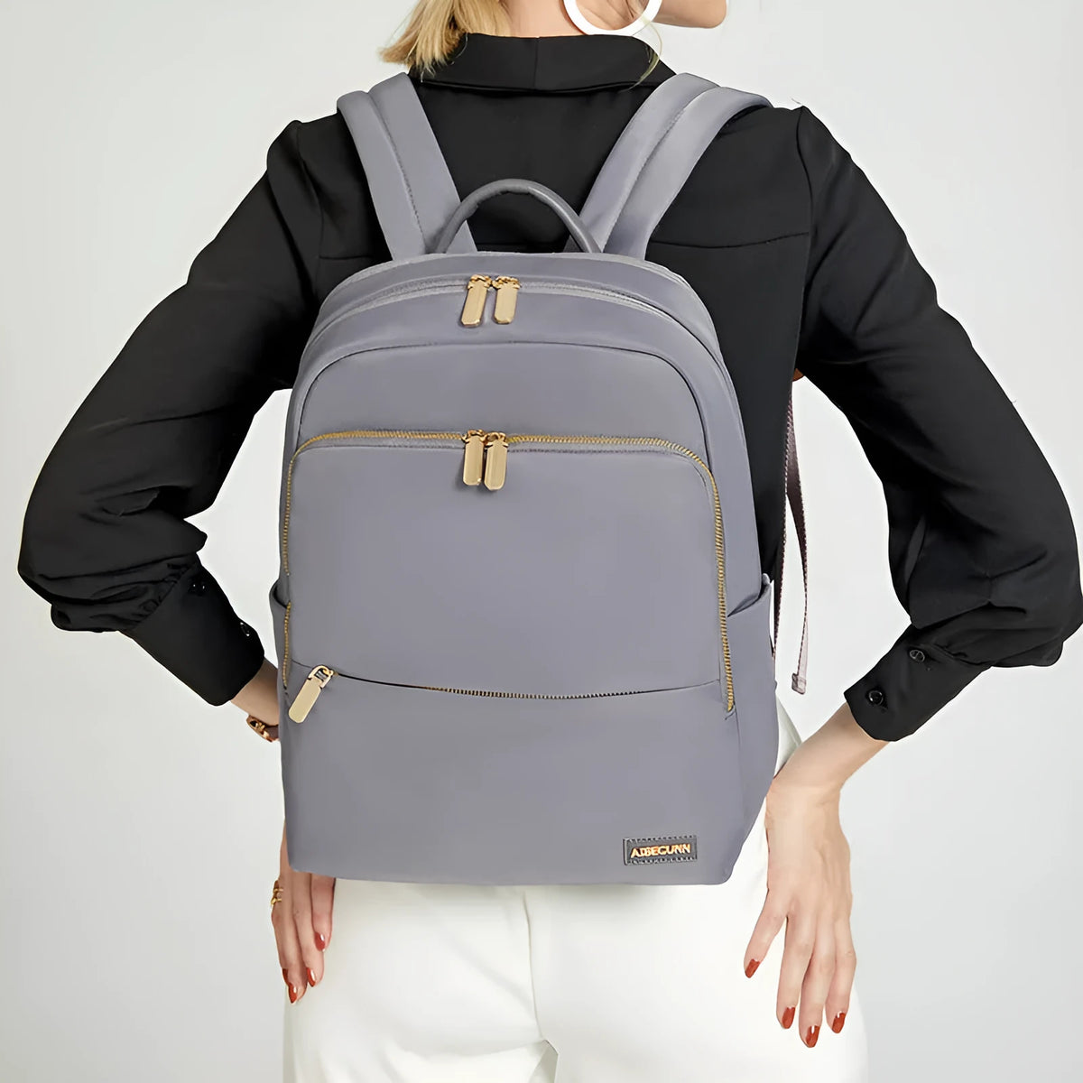Oxford cloth women's backpack in black and purplish grey colours, showing large main compartment.