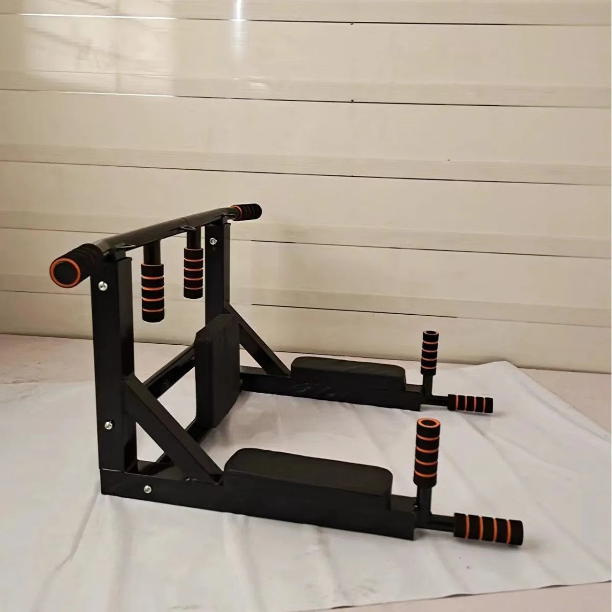 Black wall-mounted sandbag storage rack with integrated parallel bars for pull-up exercises