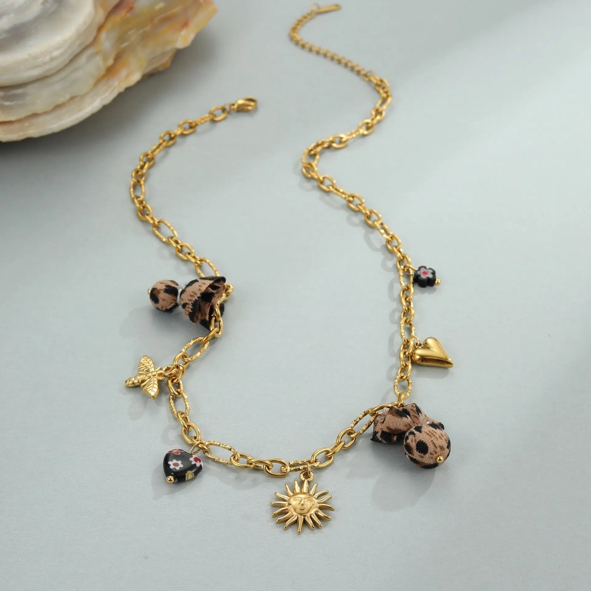 Stainless steel necklace with geometric leopard pendant featuring love heart flowers