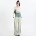 Women's gradient blue straight-leg jeans showing colour transition from lighter to darker blue tones