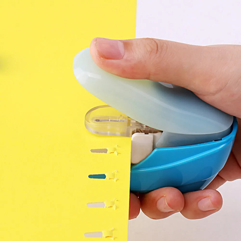 Compact stapler-free embossed paper binder in random colour on white background