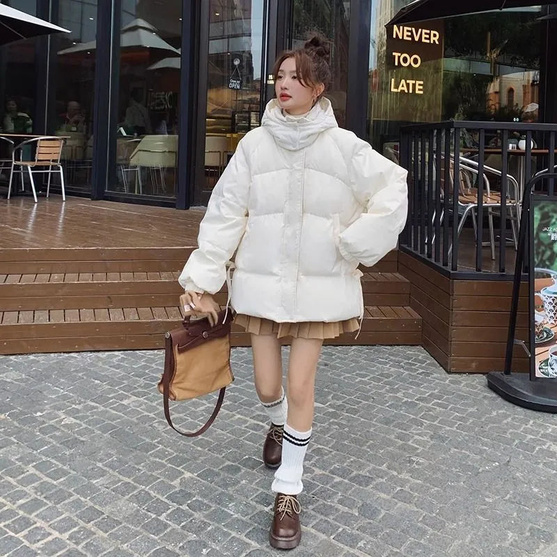 Women's milky white sleeveless insulated jacket with princess sleeves on a hanger