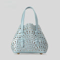 Horizontal square hollow carved PU messenger bag with three shoulder straps in apricot colour