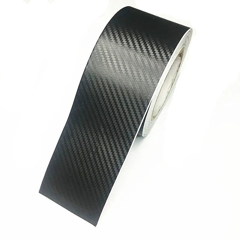 Roll of matte black 3D carbon fibre adhesive tape for protecting car door sills, showing width options.