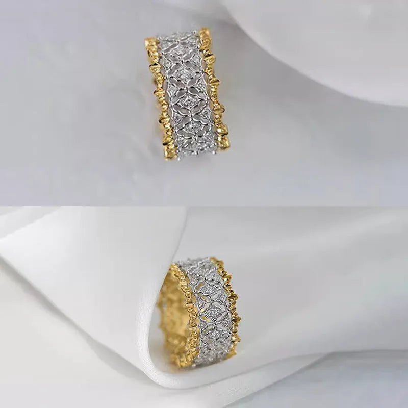 Geometric two-tone gold copper ring with round zircon accents on a solid background.