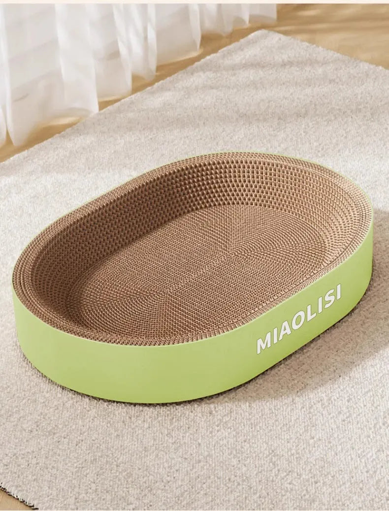 Green oval cat scratch board nest made from corrugated paper measuring 55cm in diameter