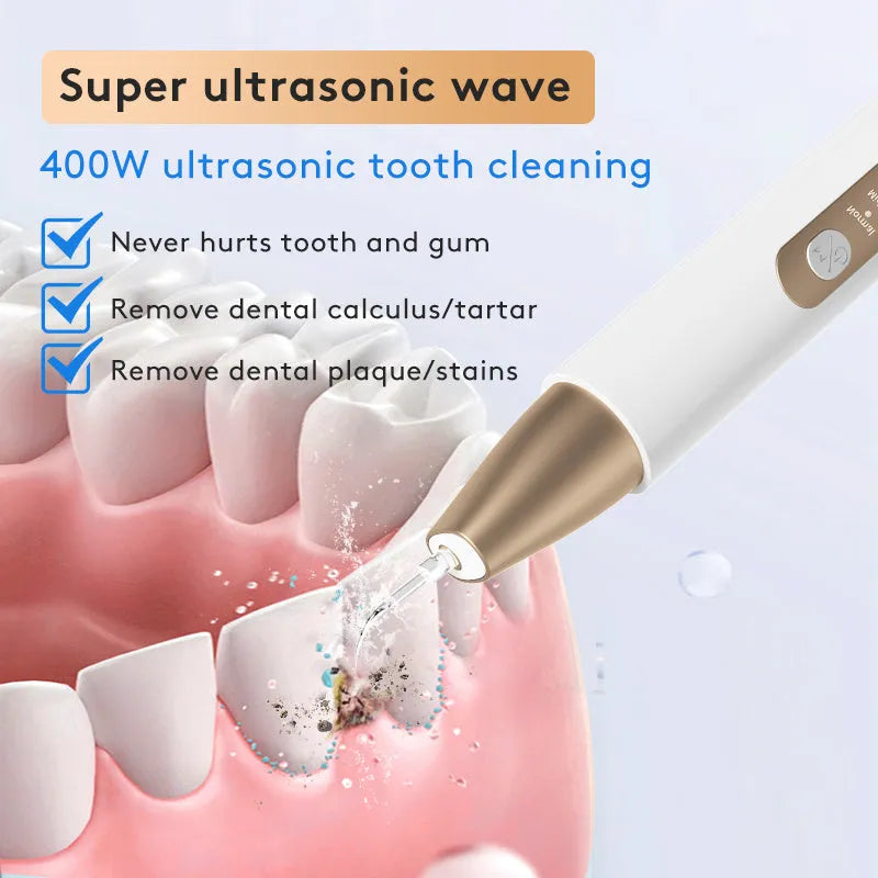 Gold-coloured ultrasonic tooth cleaning device for removing tartar and stains.