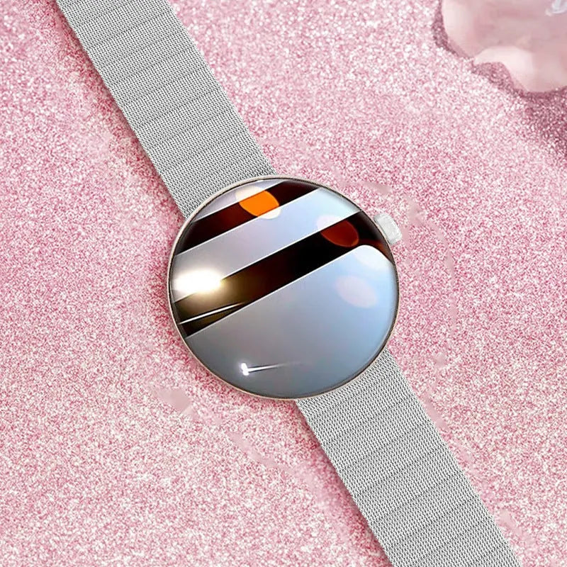 Women's smart watch with circular colour screen and metal wrist strap on wrist