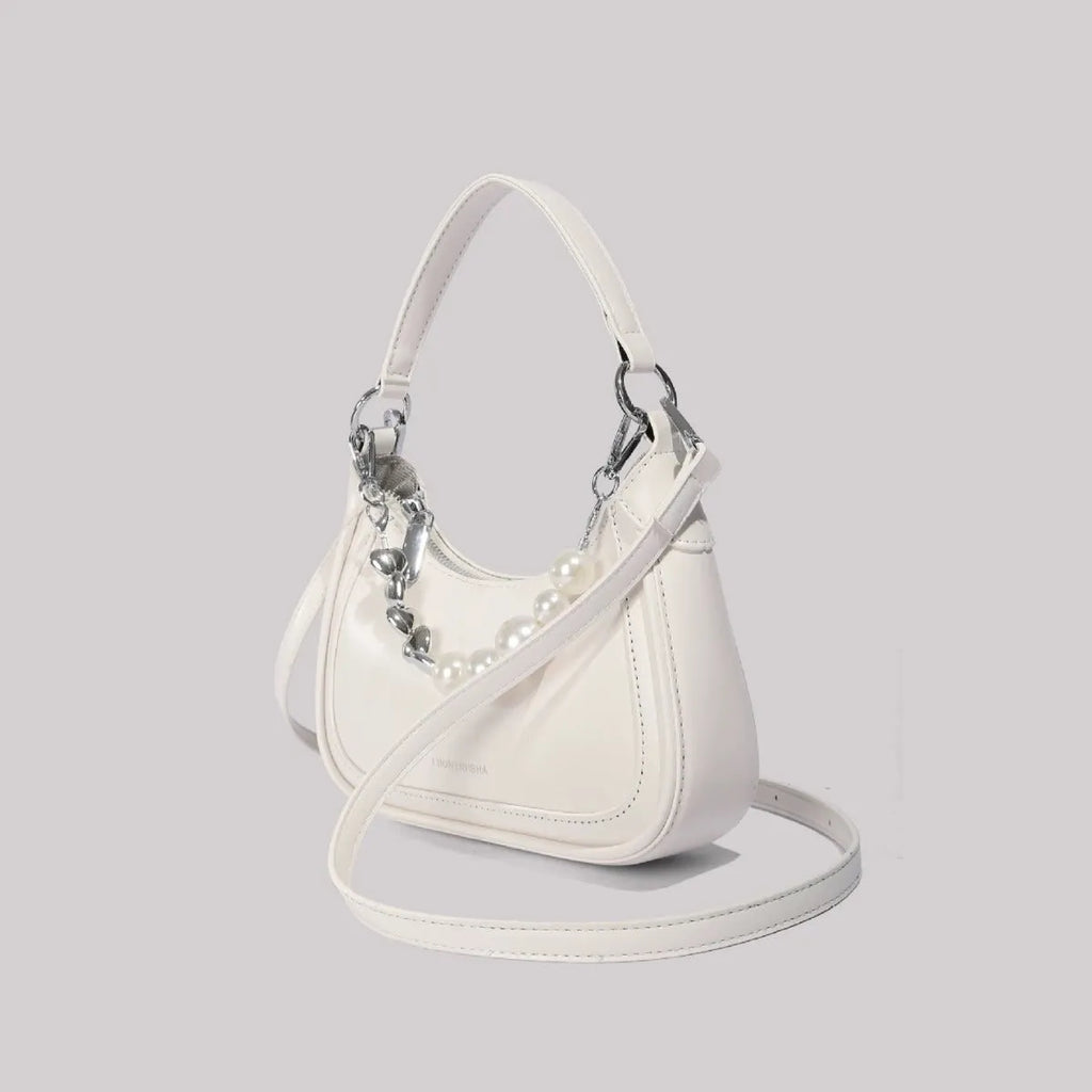 White PU crossbody shoulder bag with vertical square shape, three-dimensional outer pocket, and phone compartment.