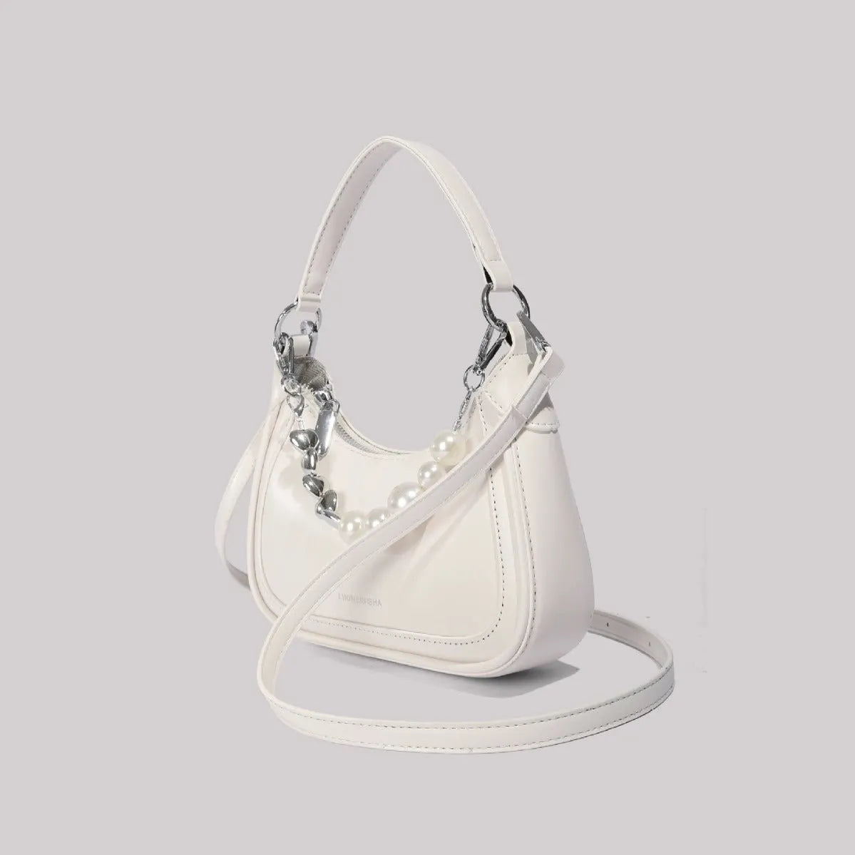 White PU crossbody shoulder bag with vertical square shape, three-dimensional outer pocket, and phone compartment.