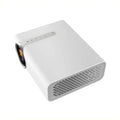 Black YG530 mini wireless mobile phone LED projector on a table, showing a large projected image.