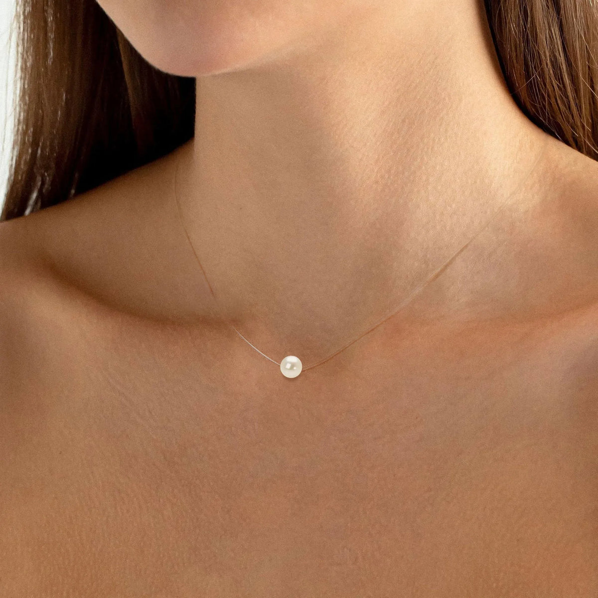 Freshwater pearl clavicle necklace with 925 sterling silver base and round geometric invisible pendant.