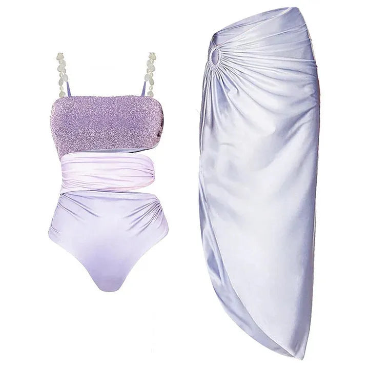 Purple one-piece swimsuit with matching wrap skirt on a mannequin, showing the tight fit and European/American styling.