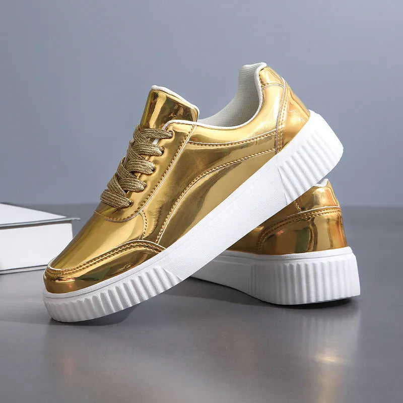 Gold sequinned platform sneaker with round toe and thick MD sole on a white background