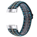 Printed elastic replacement watch strap for Fitbit Charge 6 showing adjustable fit and colour options