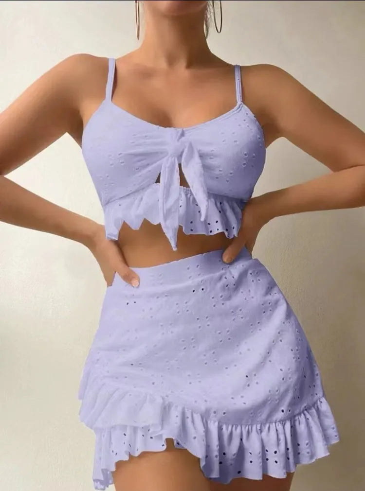 Women's three-piece bikini swimsuit with split hip skirt in solid colour
