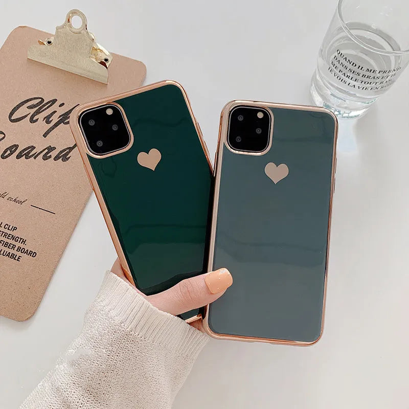 A solid colour TPU back cover case for an iPhone, shown in blue, claret, pink, and green colour options.