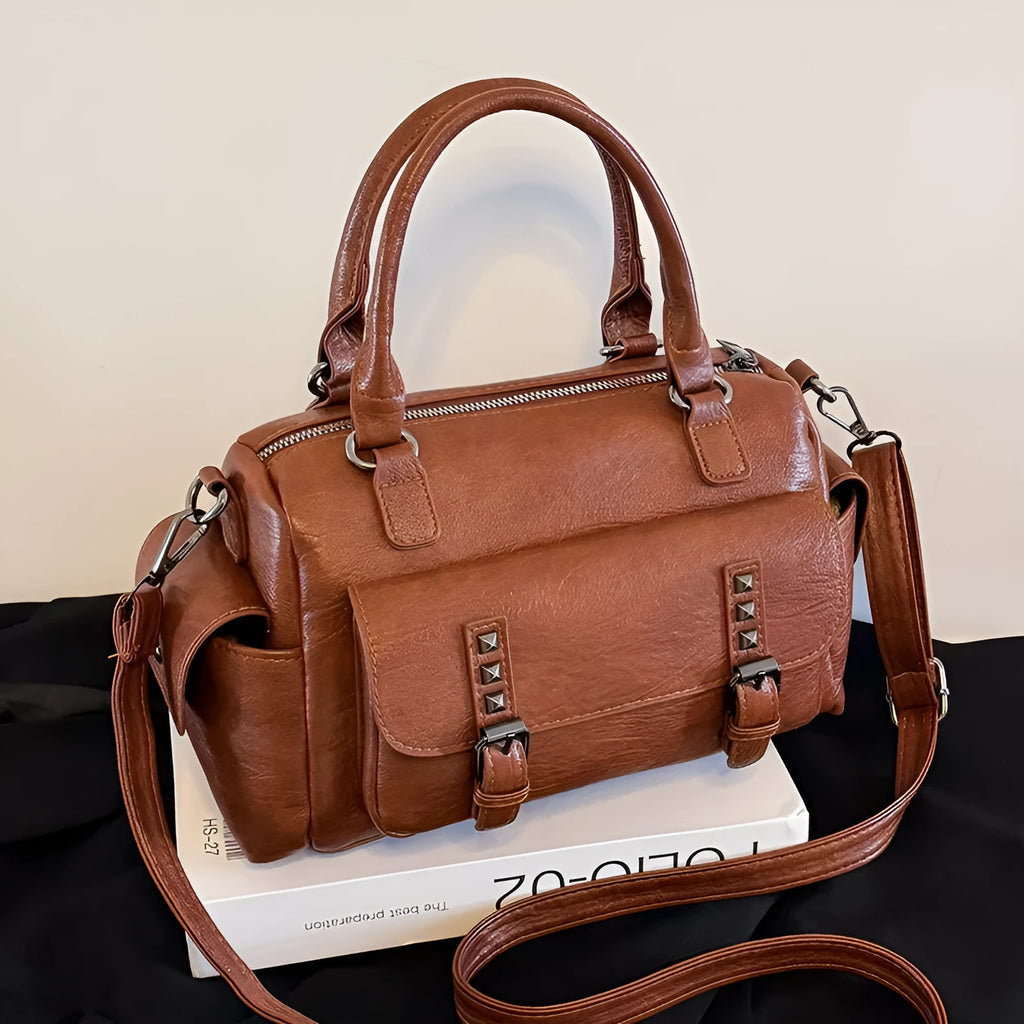 Vintage style large capacity square messenger bag in PU leather with contrast stitching.