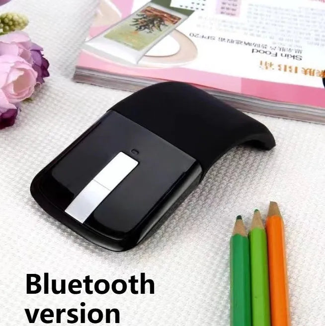 Black folding Bluetooth wireless mouse showing compact 131.2mm design with touch surface