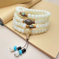White Jade Bodhi bead bracelet with 108 beads in three pattern styles.