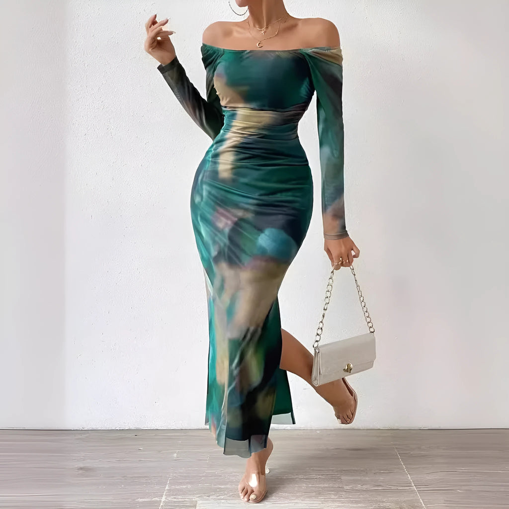 Long green gradient fishtail mesh dress with a square collar and pleated detailing on a mannequin.