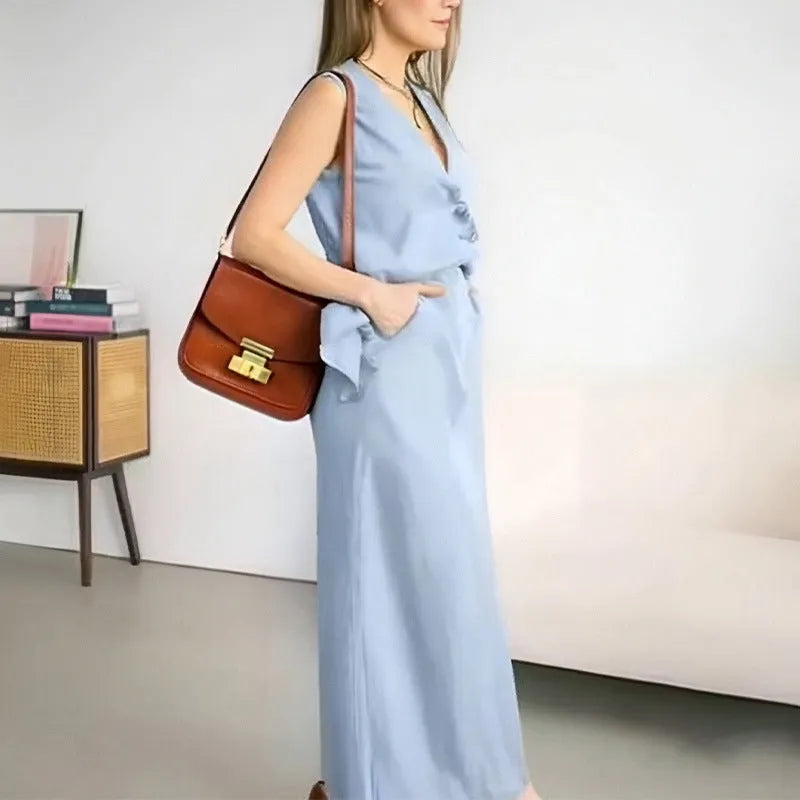 Women's blue polyester sleeveless vest and long skirt two-piece casual outfit set on a hanger.