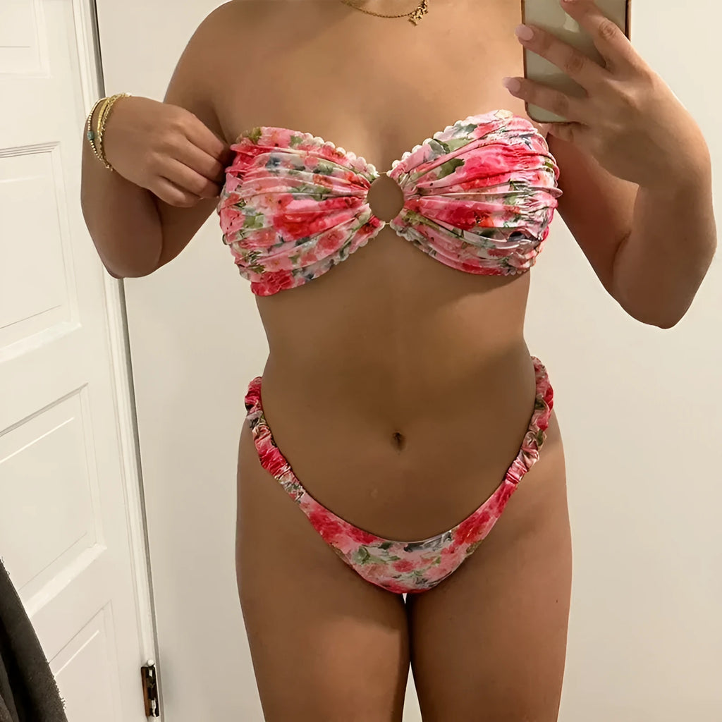 Floral print blue bikini tube top with lace trim and backless design for swimming.