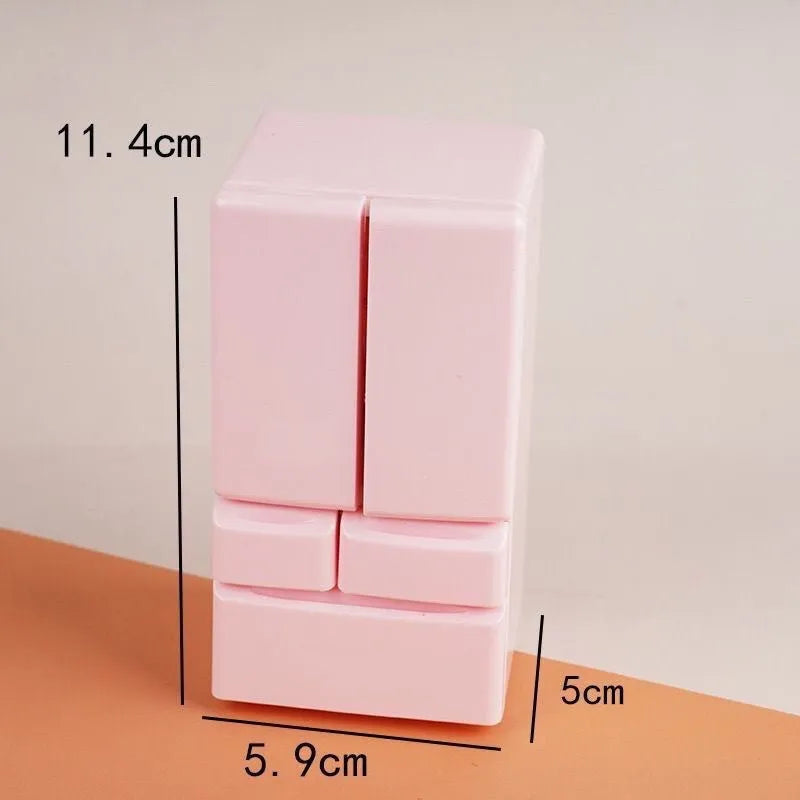 White plastic miniature candy toy model with illuminated light function, shown on a desk.