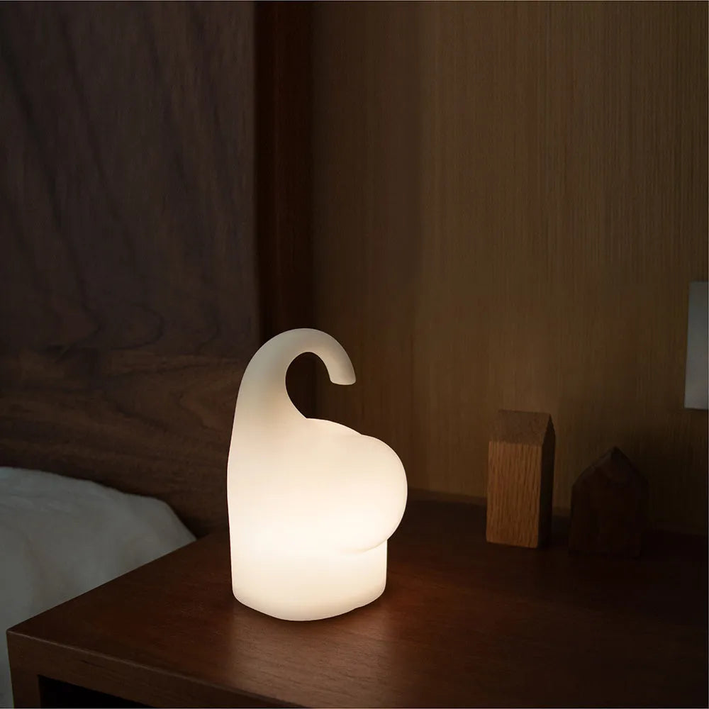DOMI Elephant Silicone Night Light with warm LED lighting on bedside table