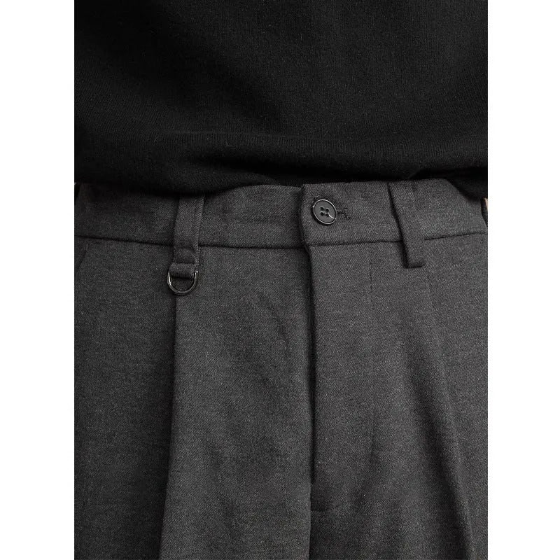 Men's straight leg polyester trousers in black, shown laid flat to display the cut and drape.