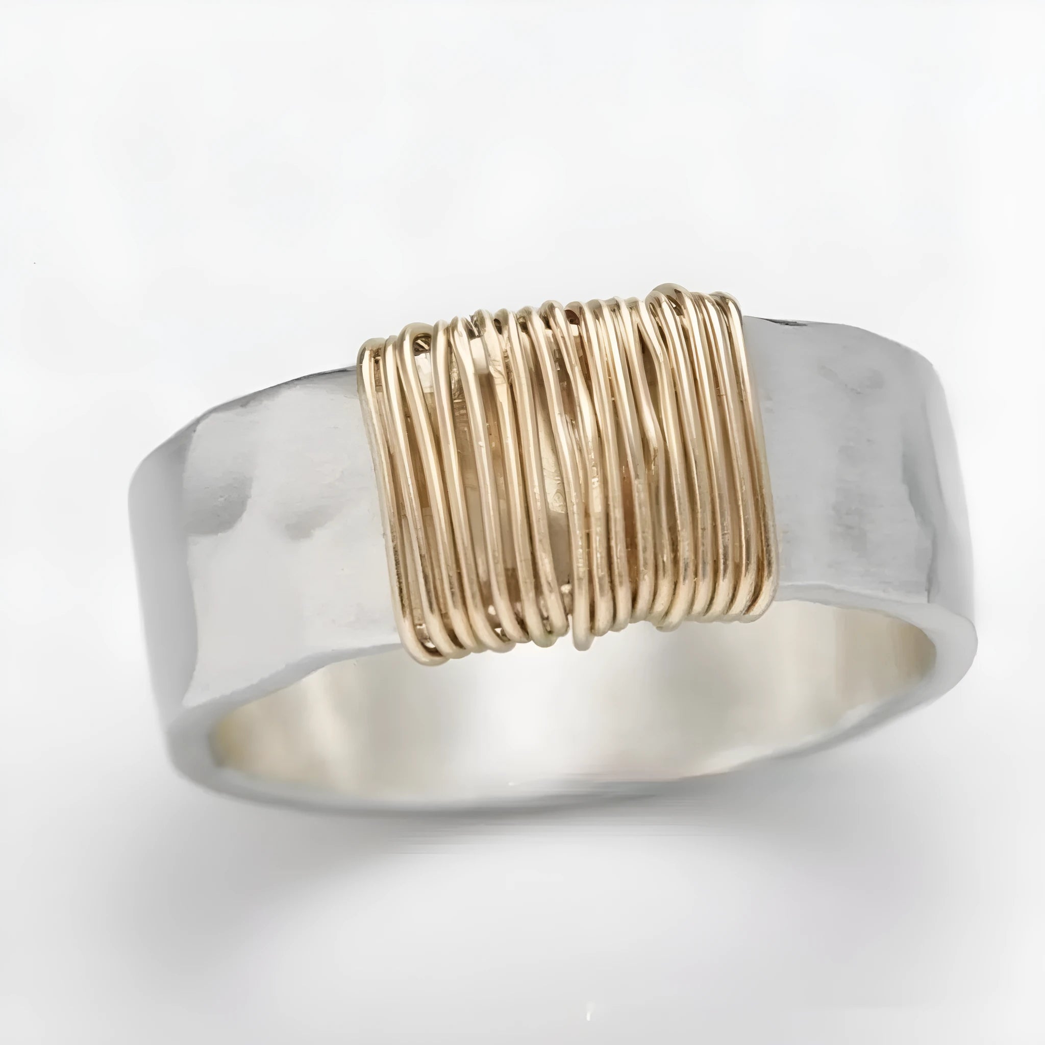 Geometric wide face copper bracelet ring with irregular coil design in silver gold finish.
